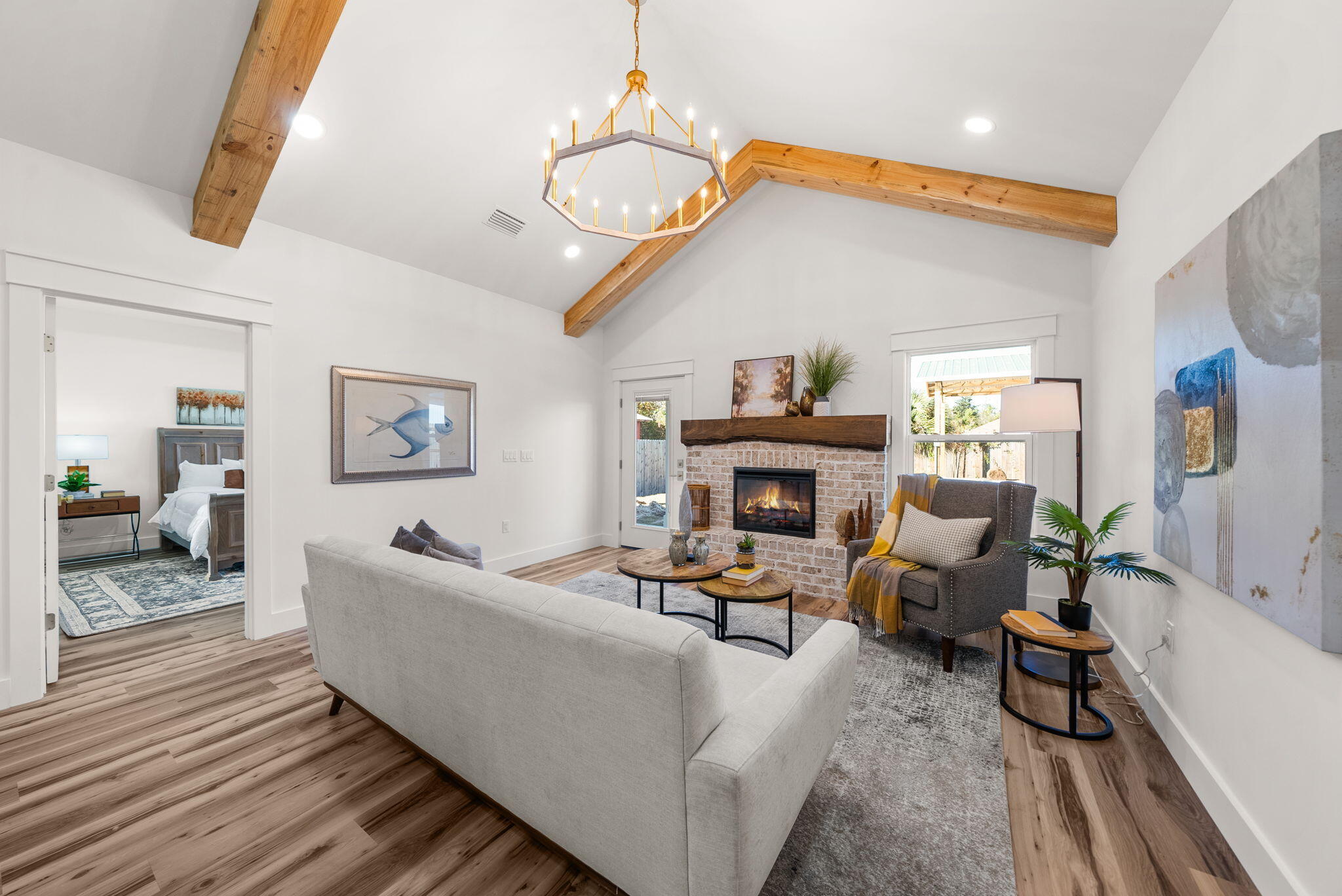 1831 McKenzie Road Southport, FL 32409 - Photo 12 of 48 a living room with furniture a fireplace and a table