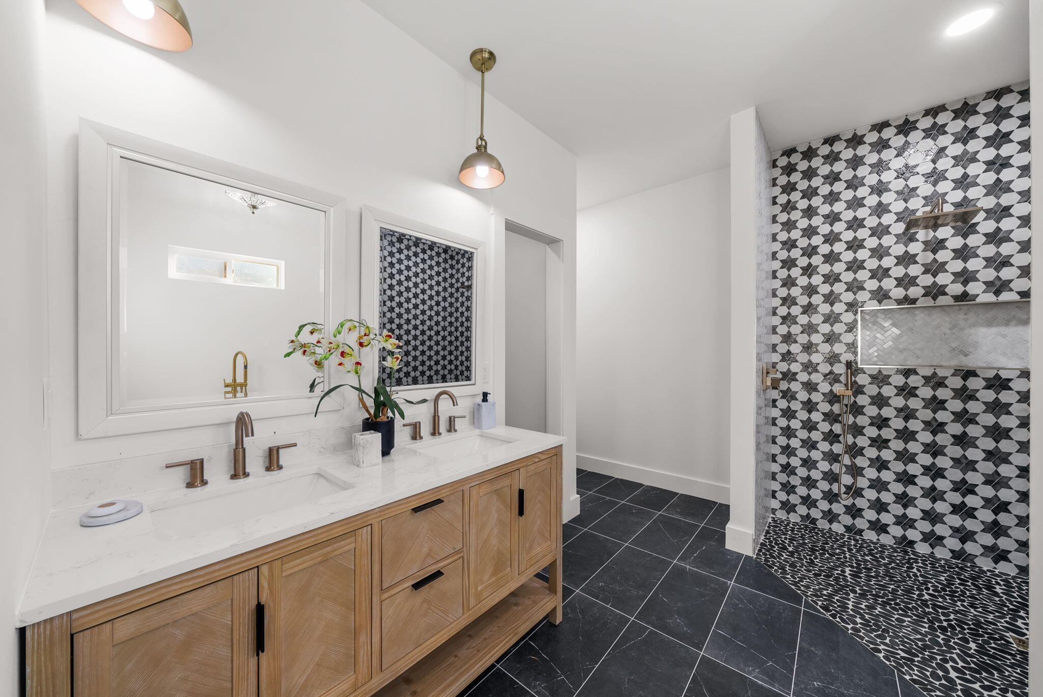 1831 McKenzie Road Southport, FL 32409 - Photo 15 of 48 a bathroom with a double vanity sink mirror and shower