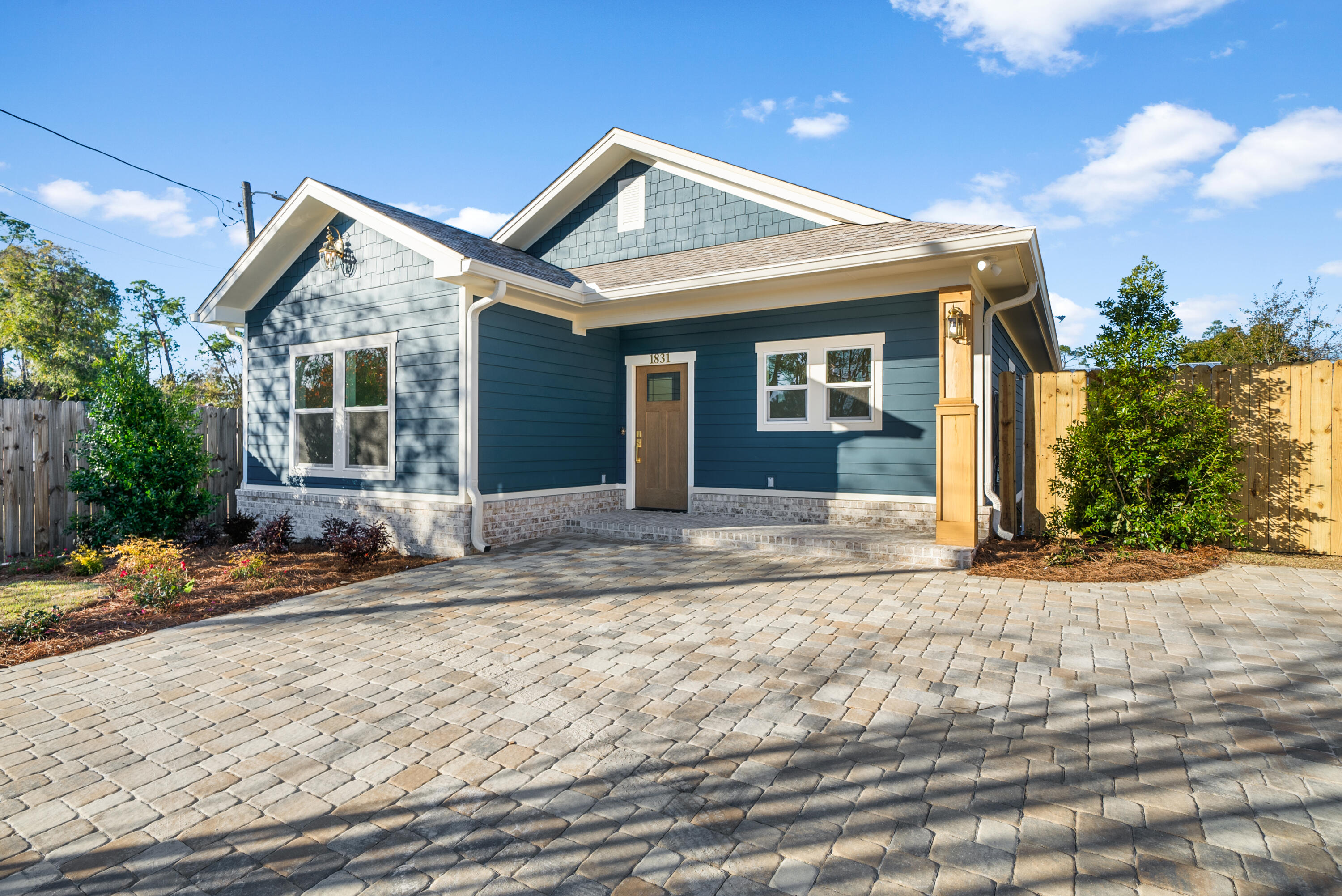 1831 McKenzie Road Southport, FL 32409 - Photo 2 of 48 a view of a house with a patio and dining space