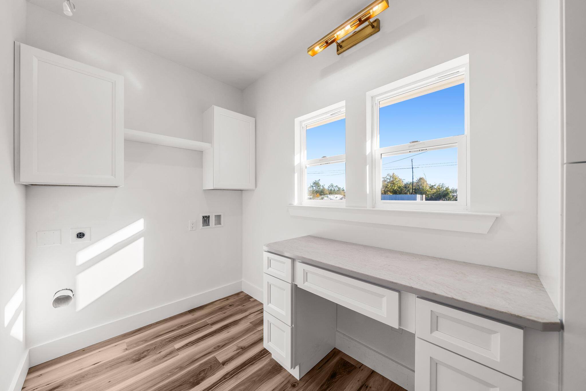 1831 McKenzie Road Southport, FL 32409 - Photo 22 of 48 a view of kitchen with cabinets and window