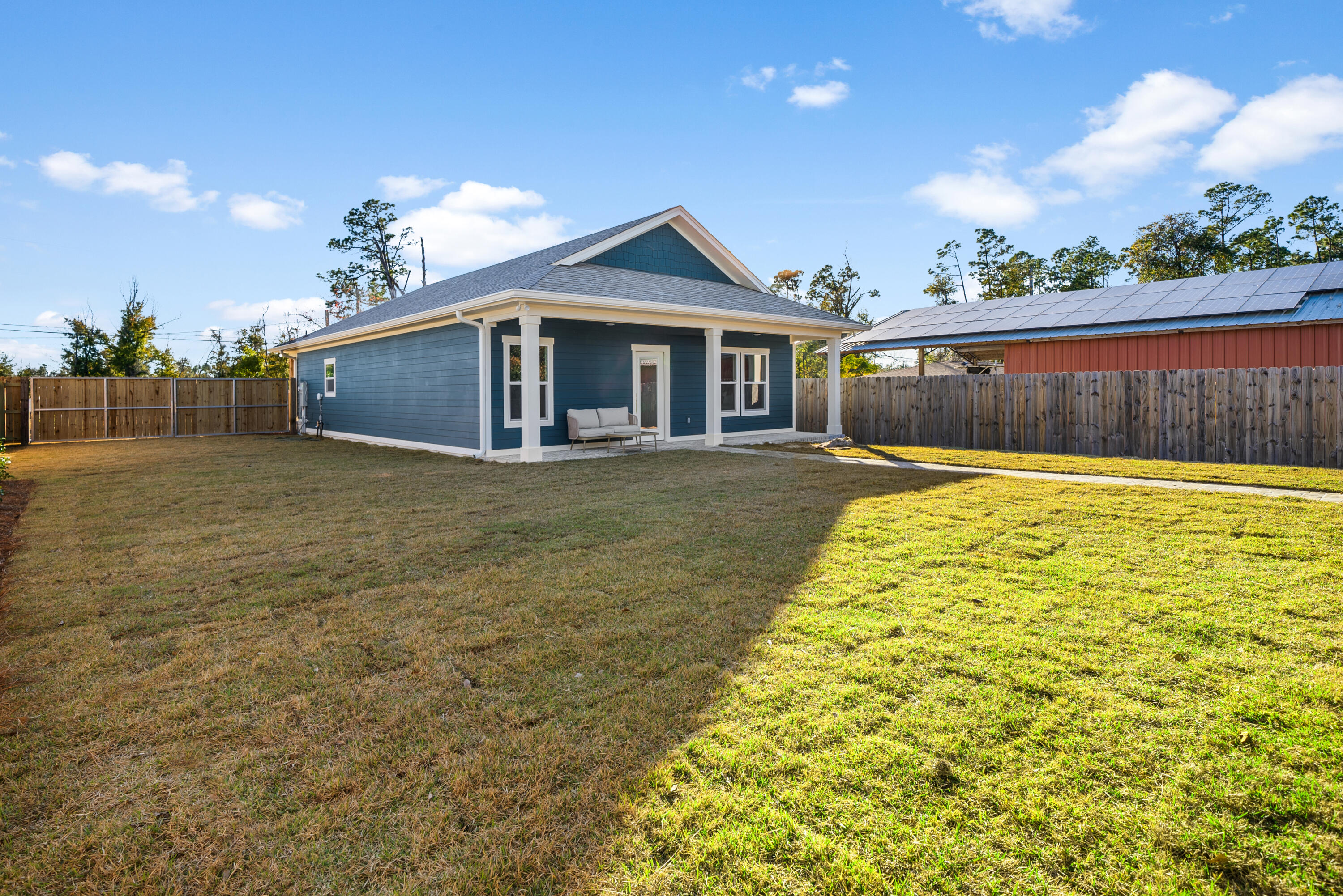 1831 McKenzie Road Southport, FL 32409 - Photo 31 of 48 a front view of a house with a yard