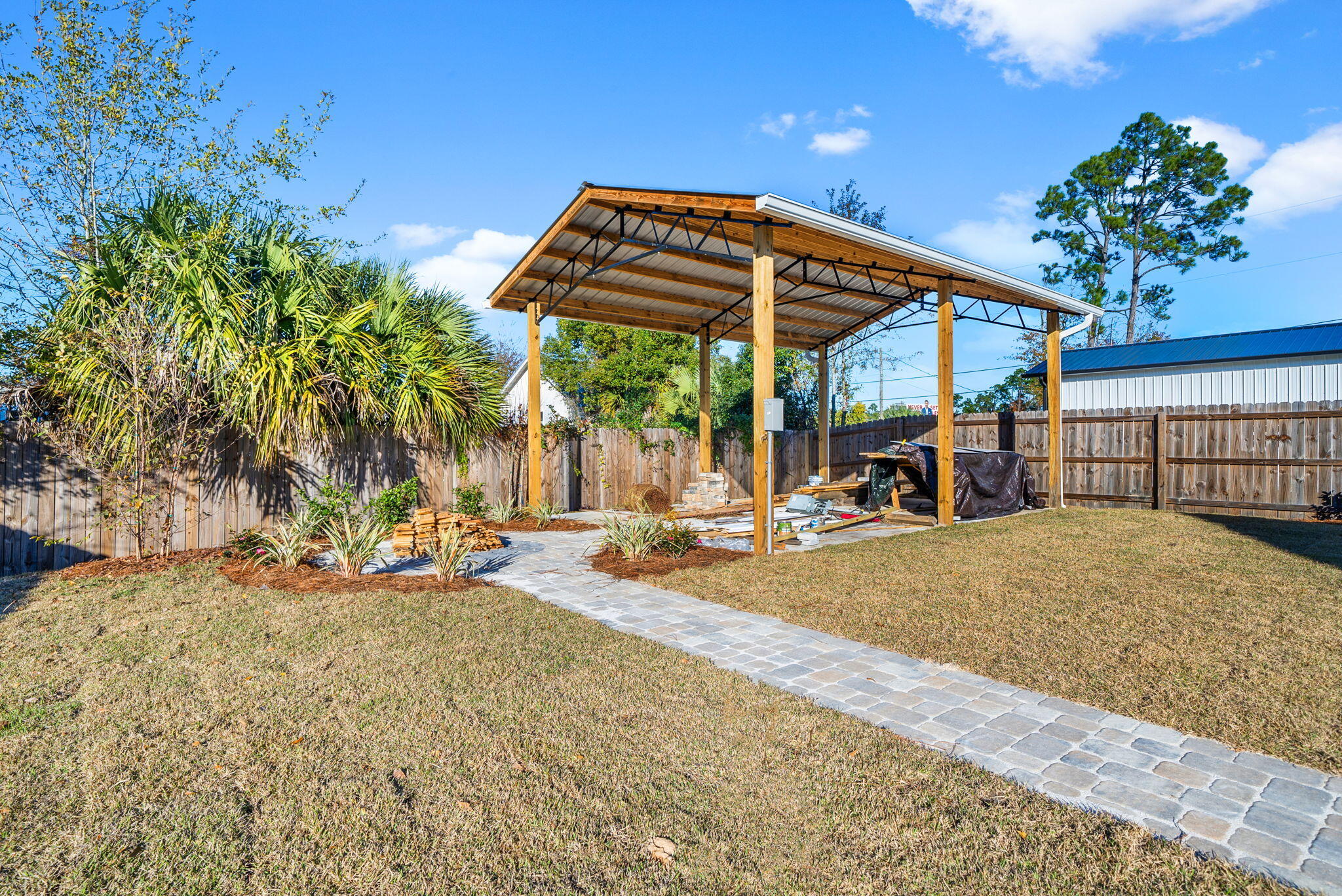 1831 McKenzie Road Southport, FL 32409 - Photo 32 of 48 a view of a outdoor space with porch and furniture
