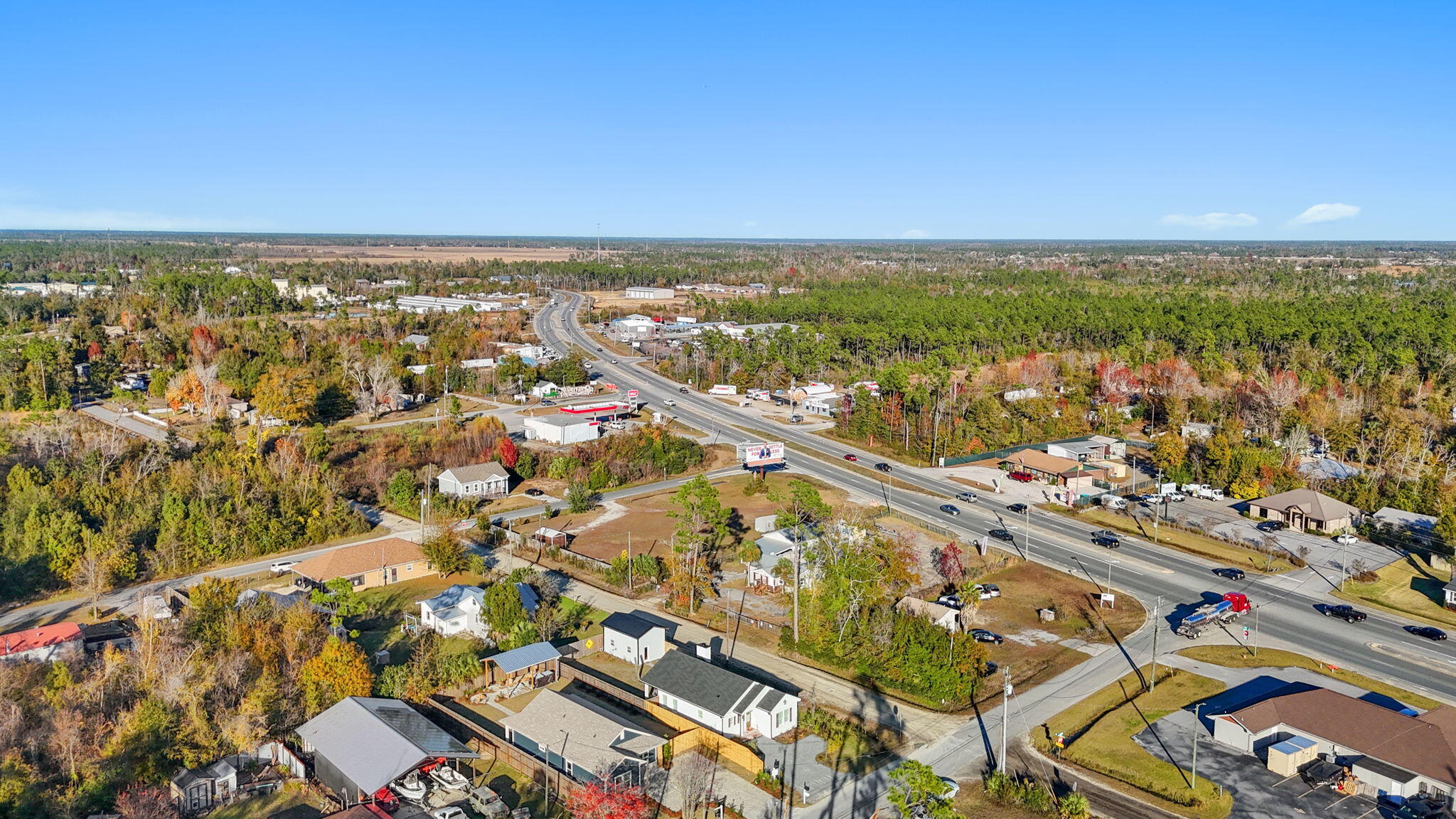 1831 McKenzie Road Southport, FL 32409 - Photo 40 of 48 an aerial view of residential building and lake