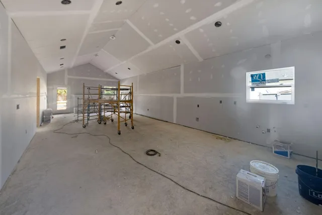 a view of a livingroom with furniture and white walls