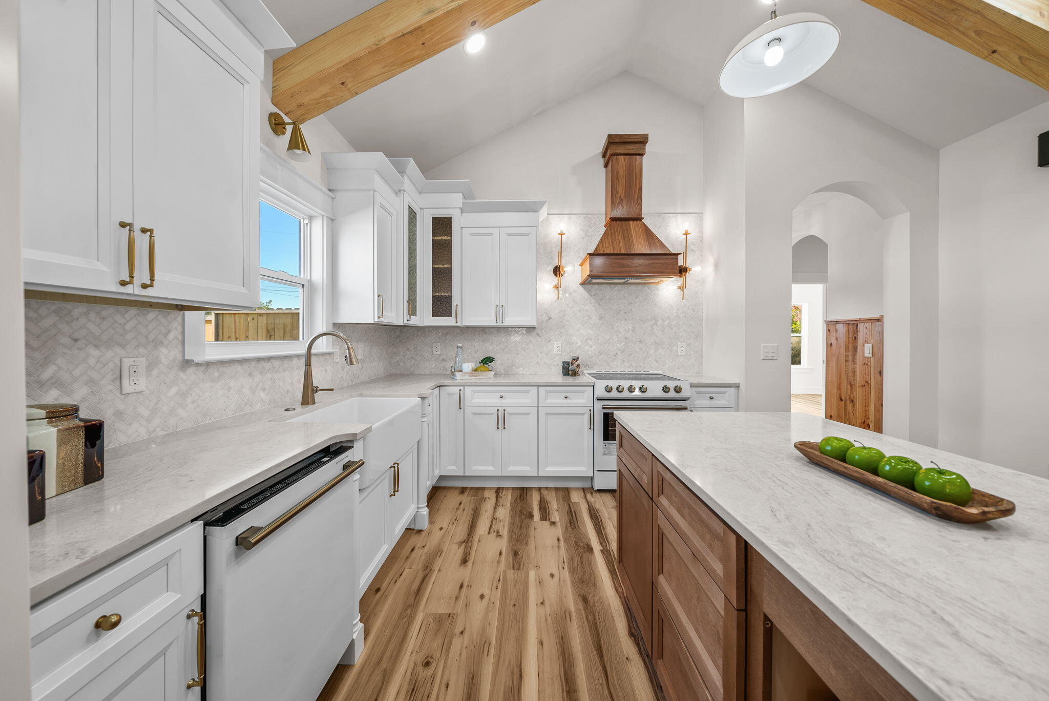 1831 McKenzie Road Southport, FL 32409 - Photo 7 of 48 a kitchen with white cabinets stove and sink