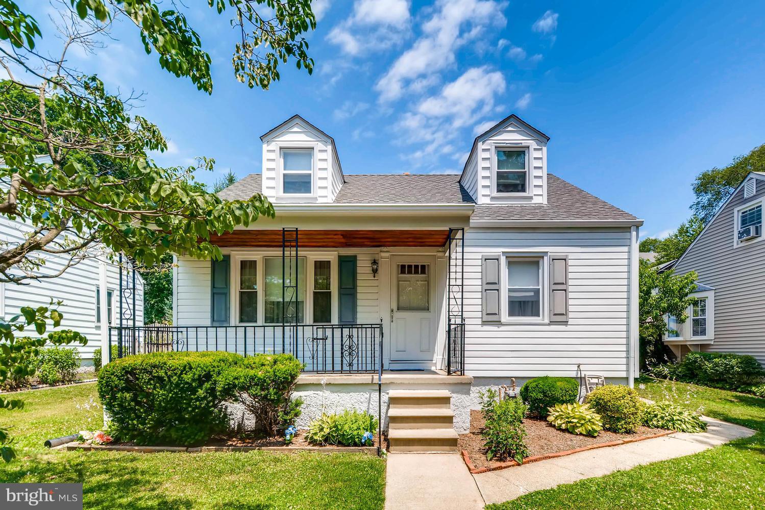 1018 St Albans Road Baltimore, MD 21239 - Photo 1 of 28 a front view of a house with a yard