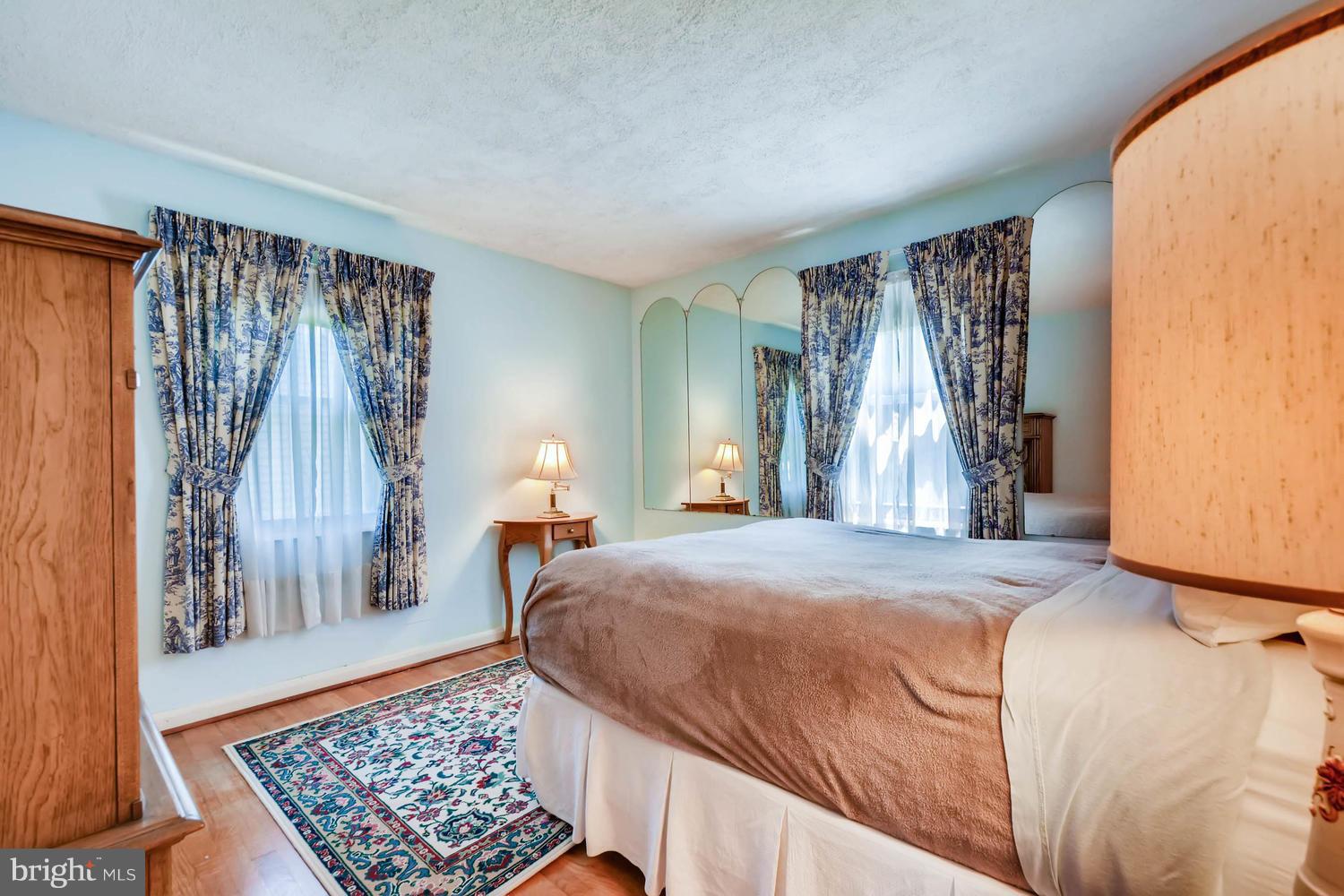 1018 St Albans Road Baltimore, MD 21239 - Photo 15 of 28 a bedroom with a large bed and a window