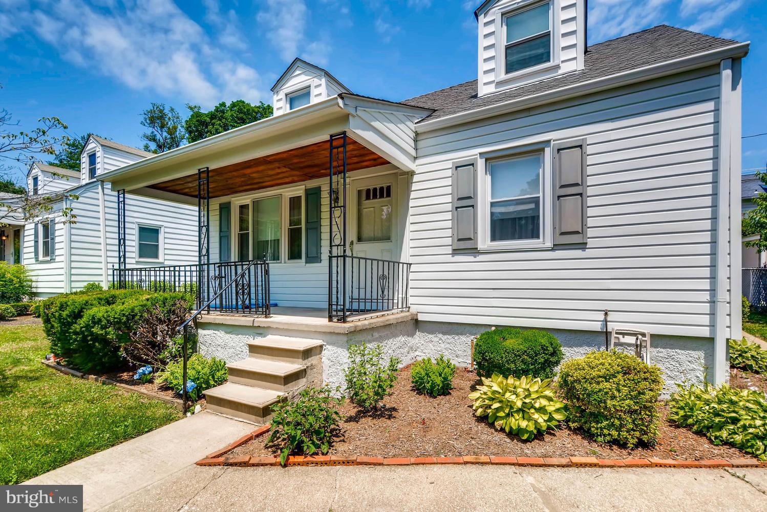 1018 St Albans Road Baltimore, MD 21239 - Photo 25 of 28 front view of a house with a yard