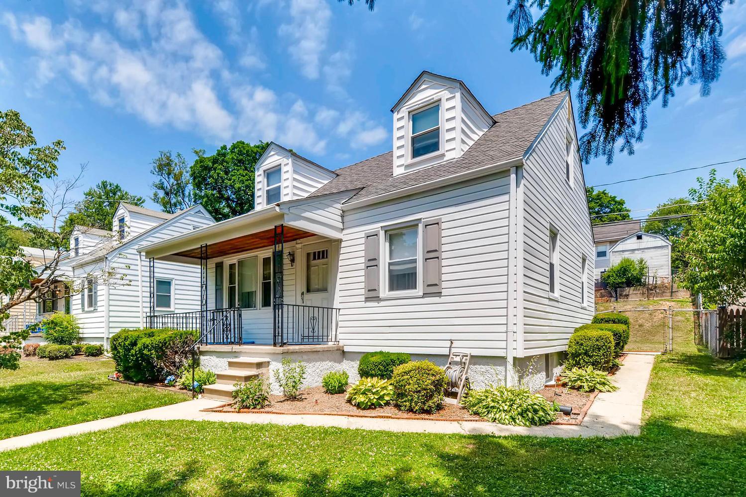 1018 St Albans Road Baltimore, MD 21239 - Photo 26 of 28 a front view of a house with a yard