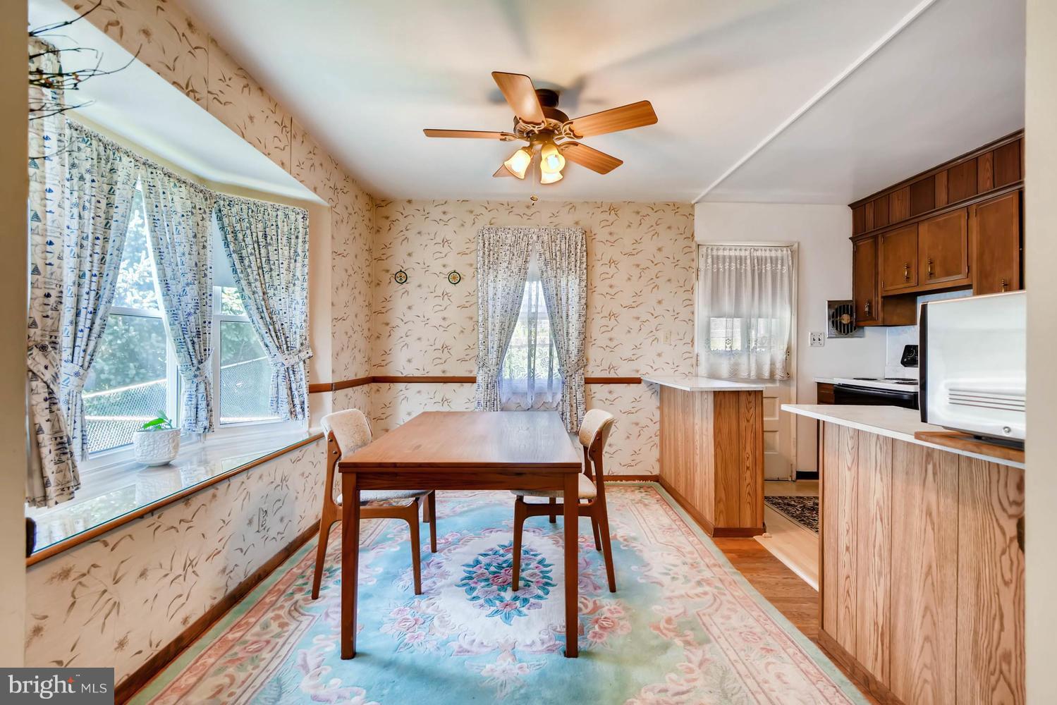 1018 St Albans Road Baltimore, MD 21239 - Photo 5 of 28 a view of a dining room with furniture window and wooden floor