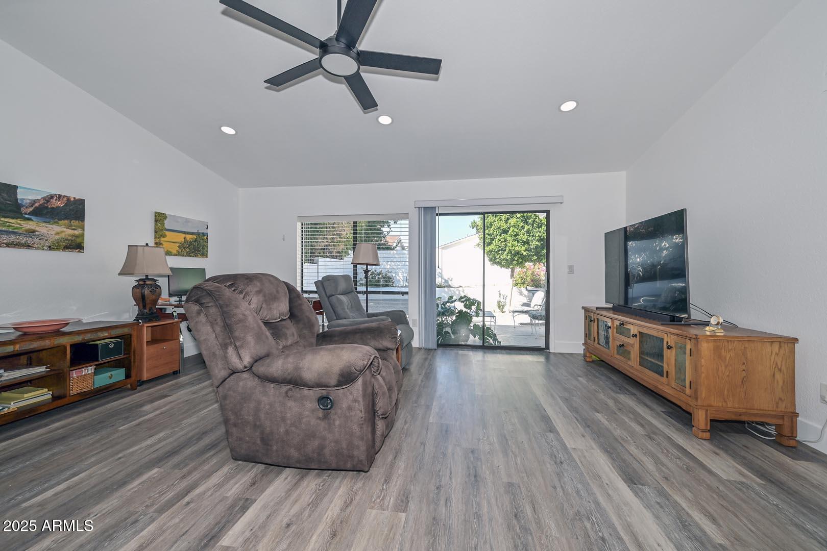 606 West Grandview Road Phoenix, AZ 85023 - Photo 12 of 33 a living room with furniture and a flat screen tv