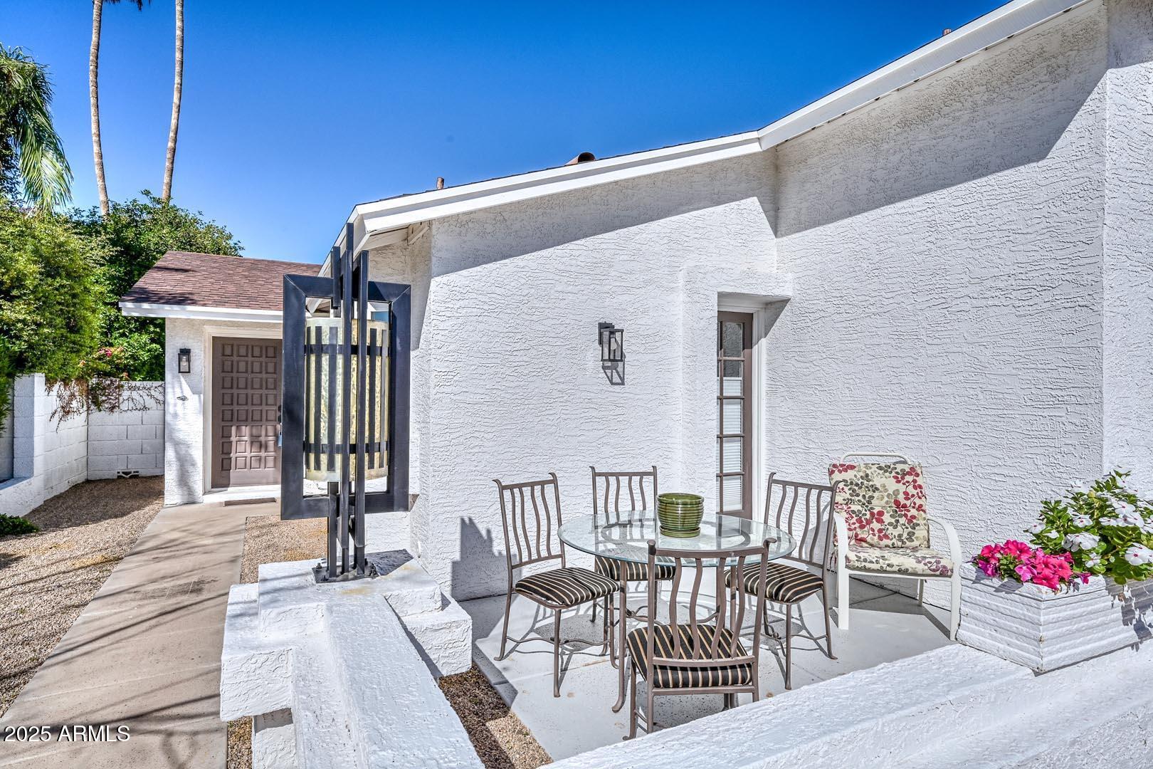 606 West Grandview Road Phoenix, AZ 85023 - Photo 2 of 33 a front view of a house with outdoor seating
