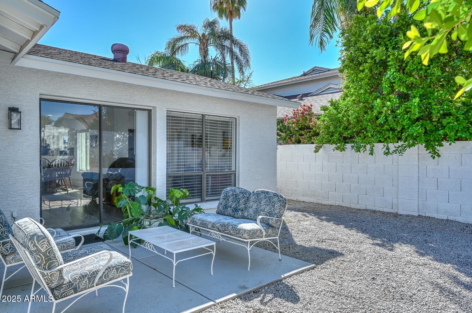 606 West Grandview Road Phoenix, AZ 85023 - Photo 25 of 33 a outdoor living space with furniture potted plant and glass windows