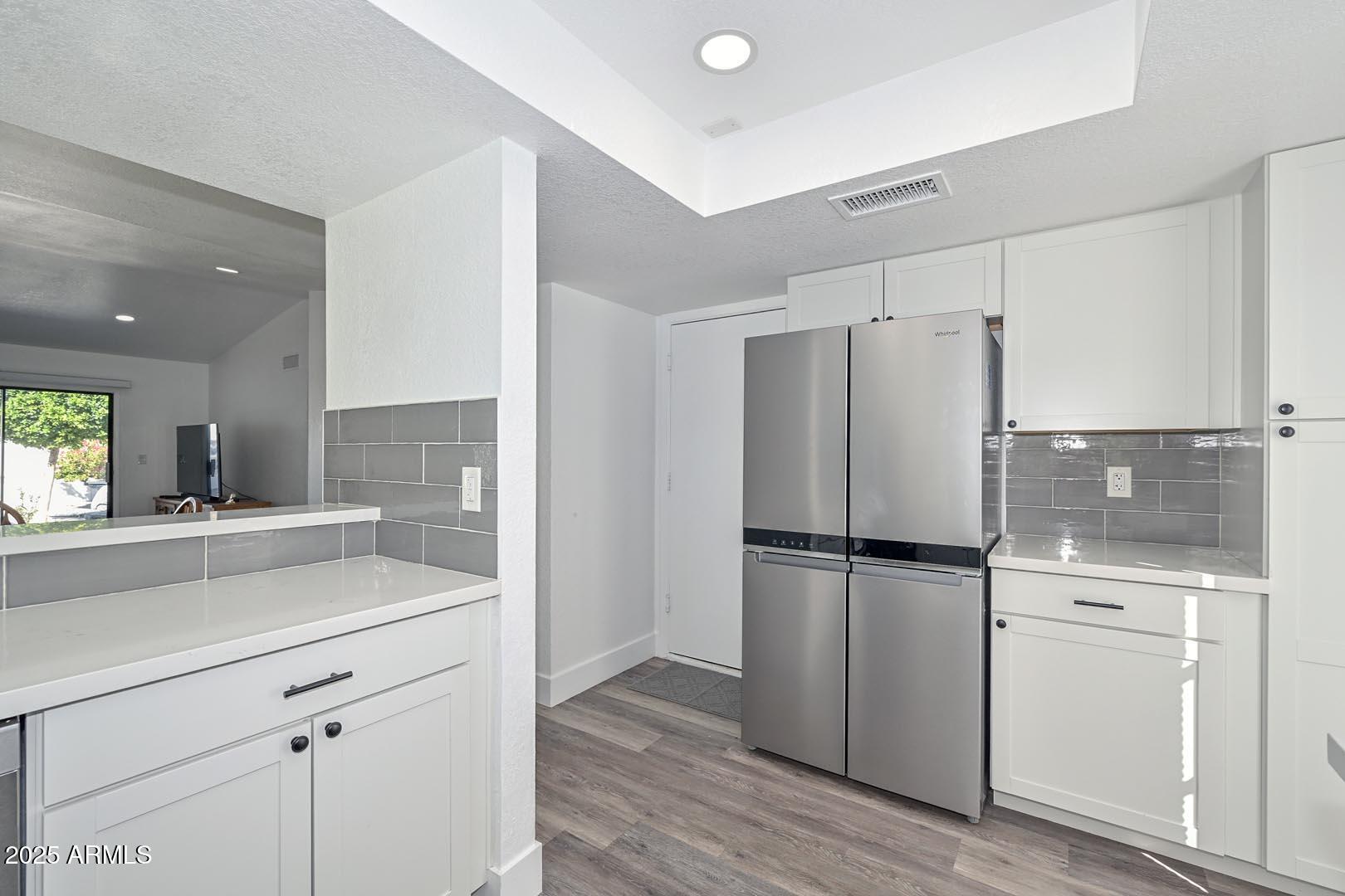 606 West Grandview Road Phoenix, AZ 85023 - Photo 8 of 33 a kitchen with a refrigerator sink and cabinets