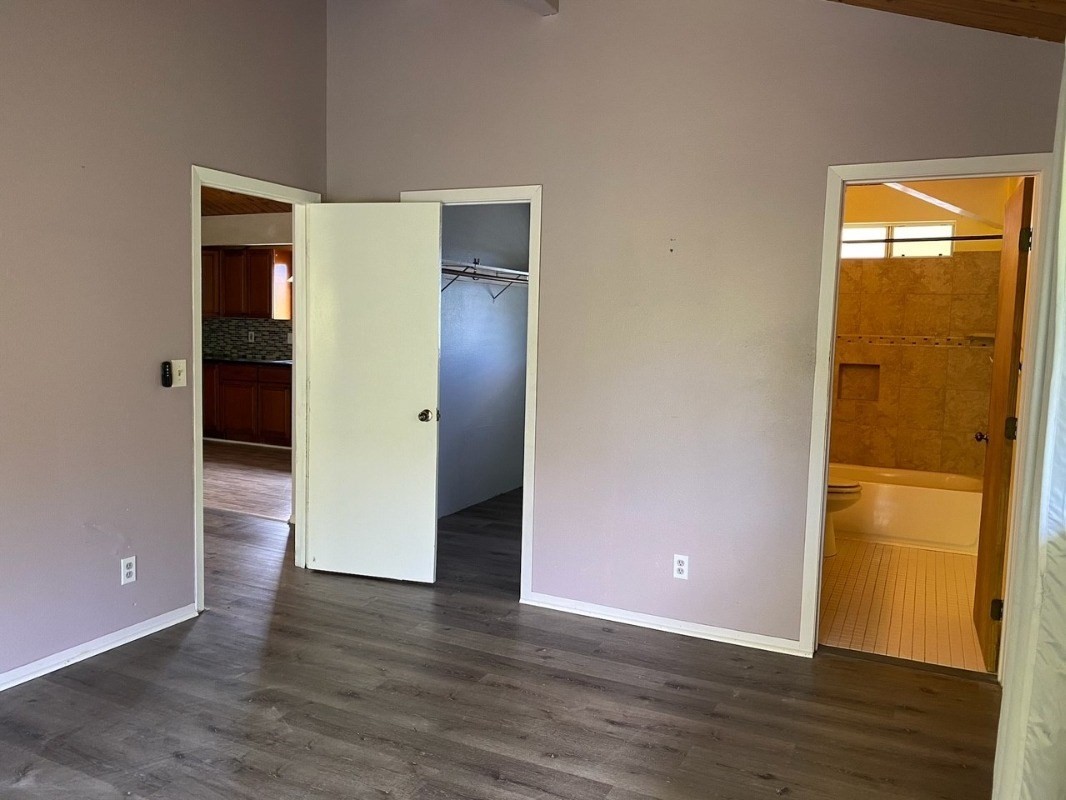 4489 Punee Road Koloa, HI 96756 - Photo 13 of 27 an empty room with wooden floor and closet