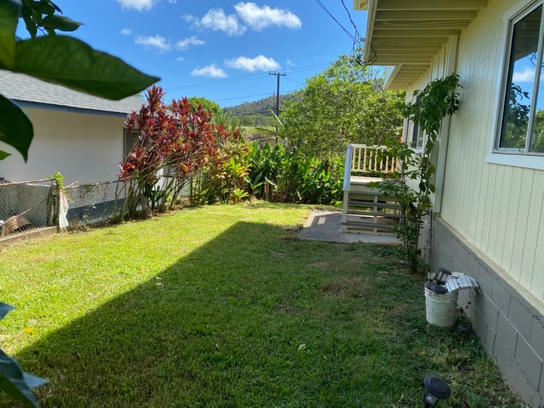 4489 Punee Road Koloa, HI 96756 - Photo 26 of 27 a view of a chair and table in backyard of the house