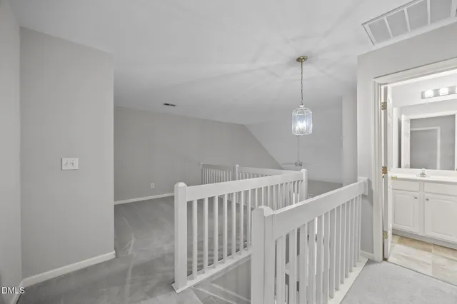 a view of a hallway view with staircase