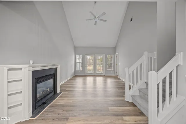 a view of an entryway with wooden floor