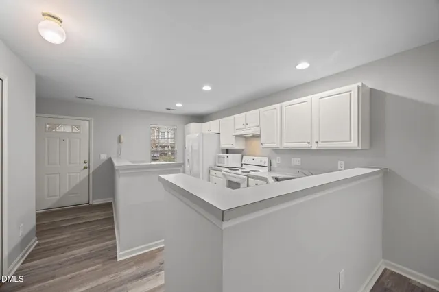 a view of kitchen with wooden floor