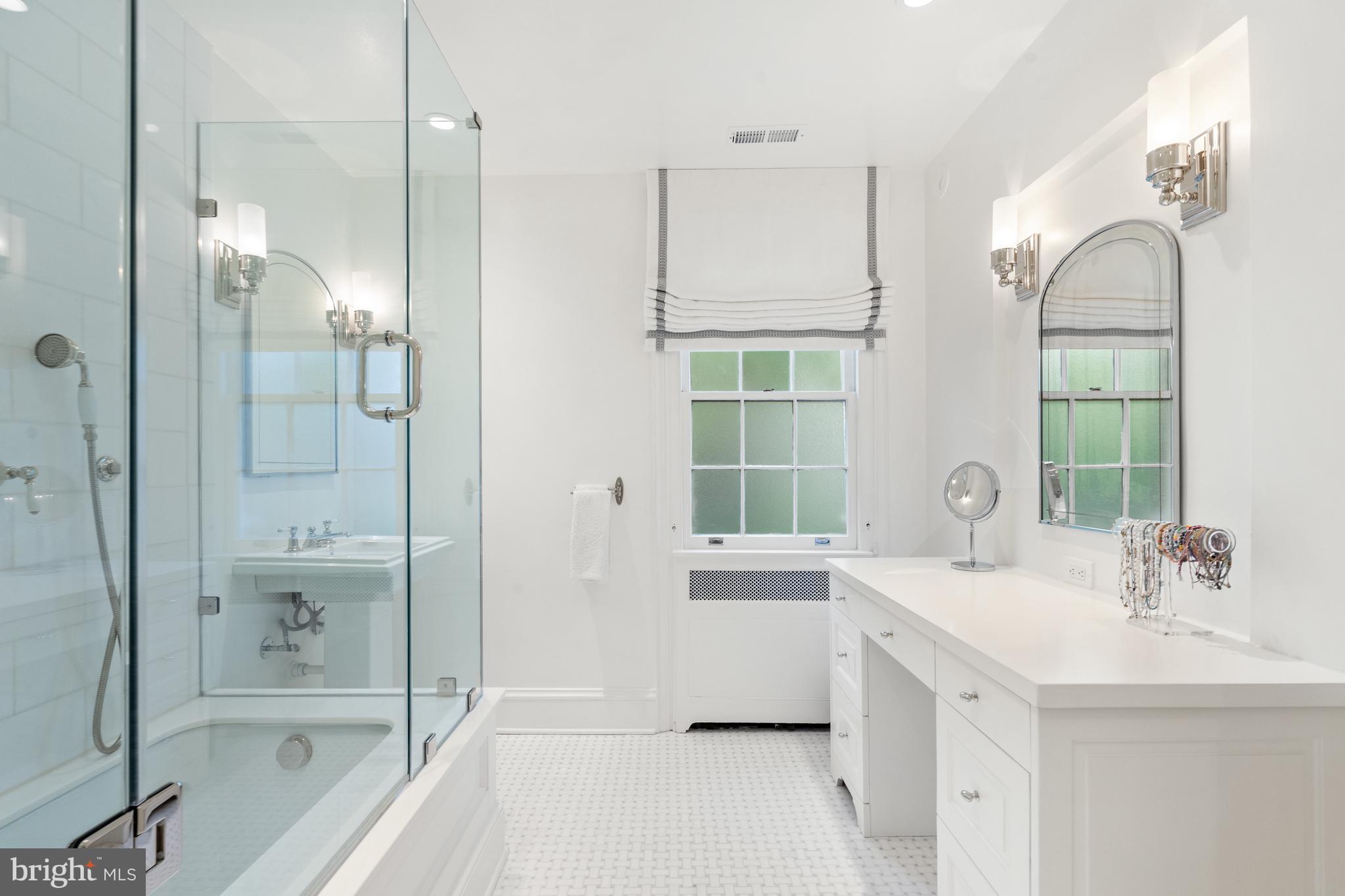 1671 31st Street Northwest Washington, DC 20007 - Photo 17 of 27 a bathroom with a bathtub shower sink and mirror