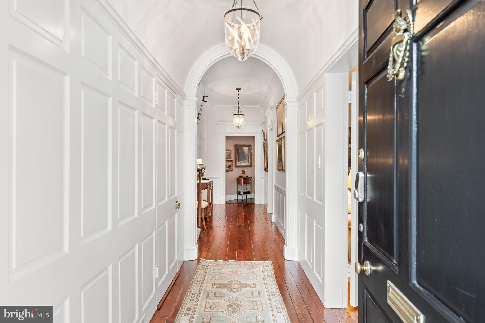 1671 31st Street Northwest Washington, DC 20007 - Photo 2 of 27 a view of a hallway with wooden floor and staircase