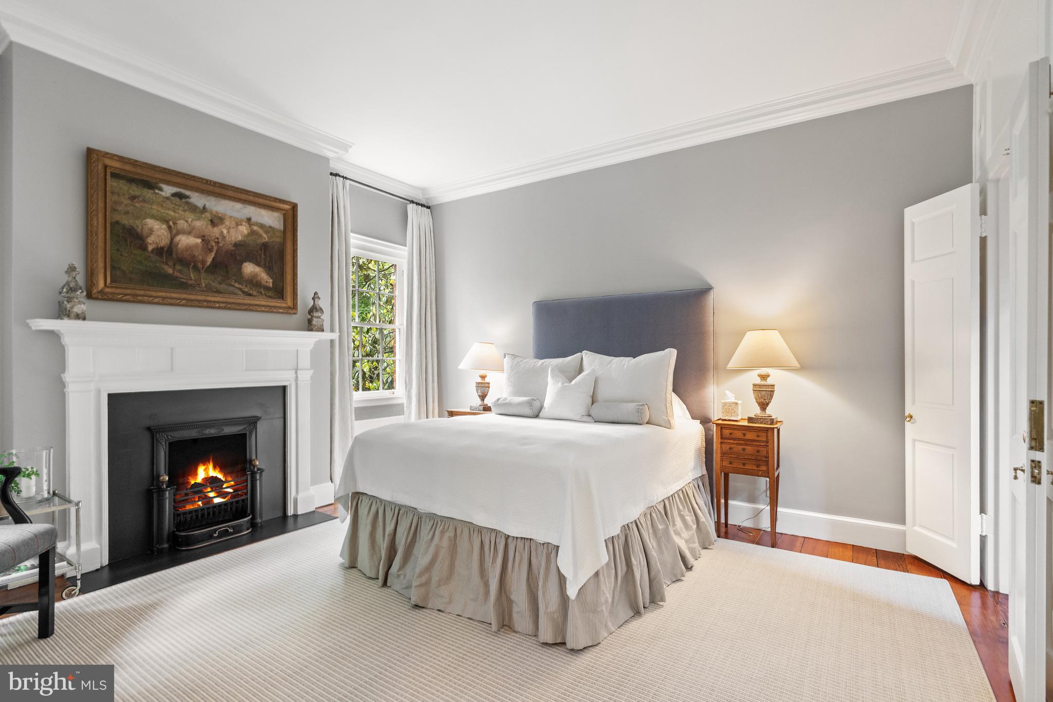 1671 31st Street Northwest Washington, DC 20007 - Photo 10 of 27 a bedroom with a bed and a fireplace