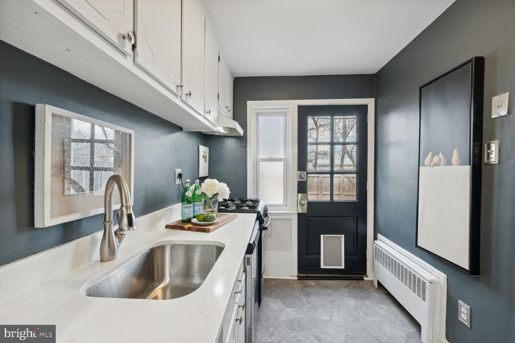 2913 16th Road South, Unit B Arlington, VA 22204 - Photo 6 of 23 a kitchen with sink refrigerator and cabinets