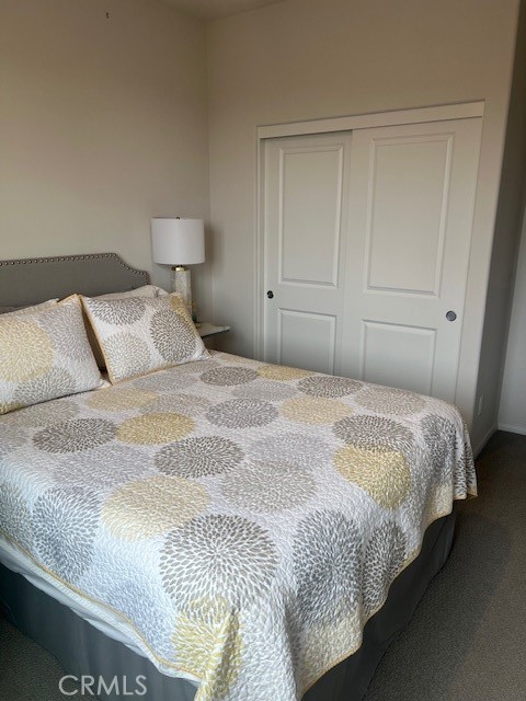 29901 Bridlegate Way Menifee, CA 92584 - Photo 23 of 43 a bedroom with a bed and a night stand