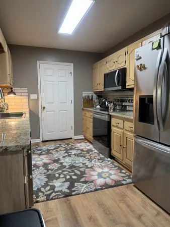 a view of a dining room with furniture and window