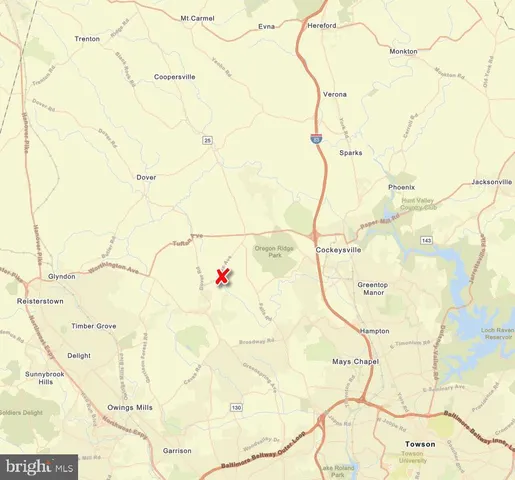 a white bath tub sitting next to a white wall and a wooden floor