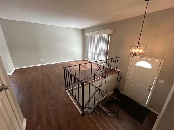 a view of entryway with wooden floor