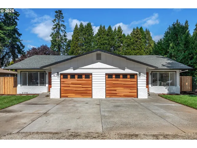 a backyard of a house with yard and garage