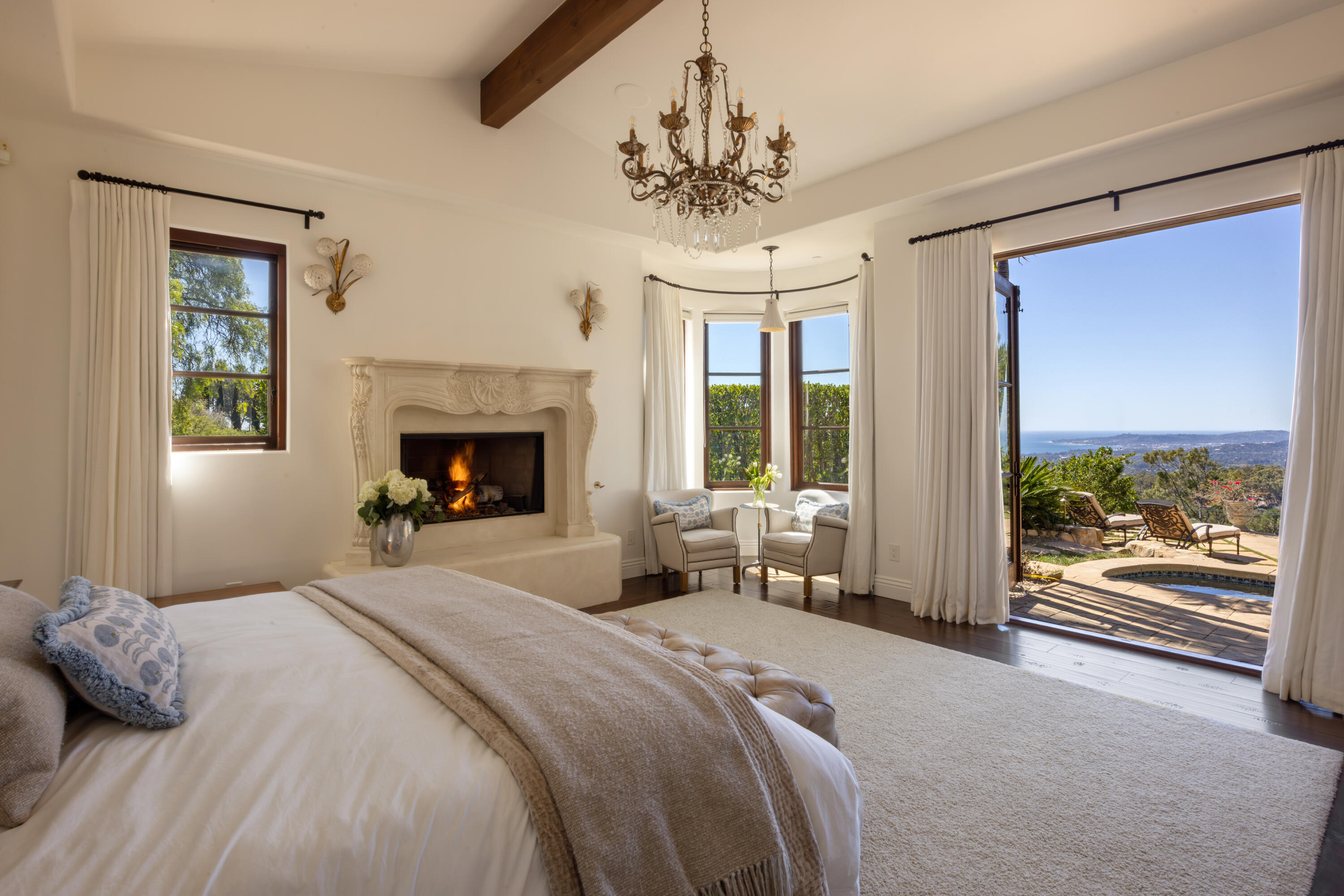 3091 Hidden Valley Lane Montecito, CA 93108 - Photo 11 of 62 a bedroom with a bed and a fireplace
