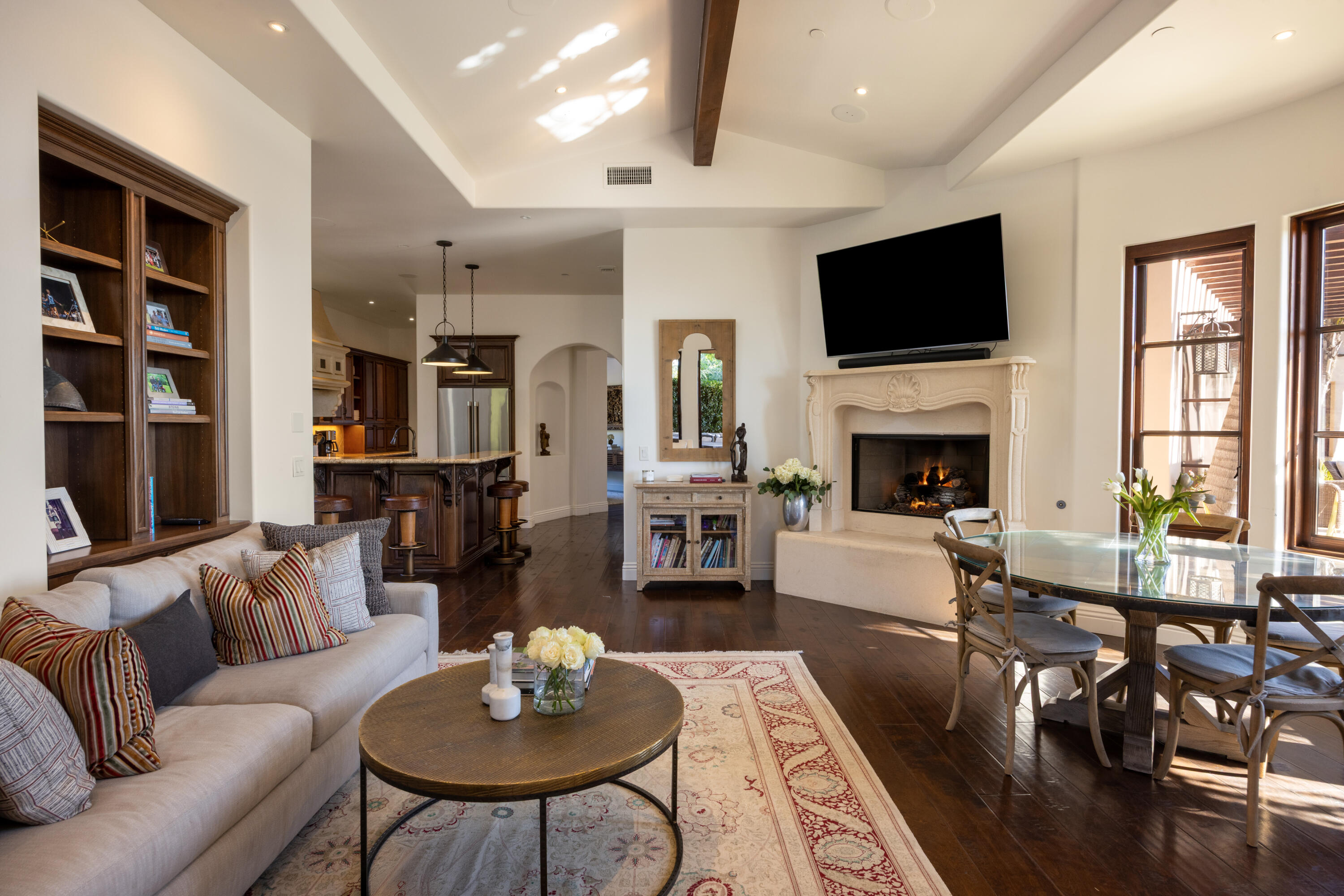 3091 Hidden Valley Lane Montecito, CA 93108 - Photo 18 of 62 a living room with furniture flat screen tv and a fireplace