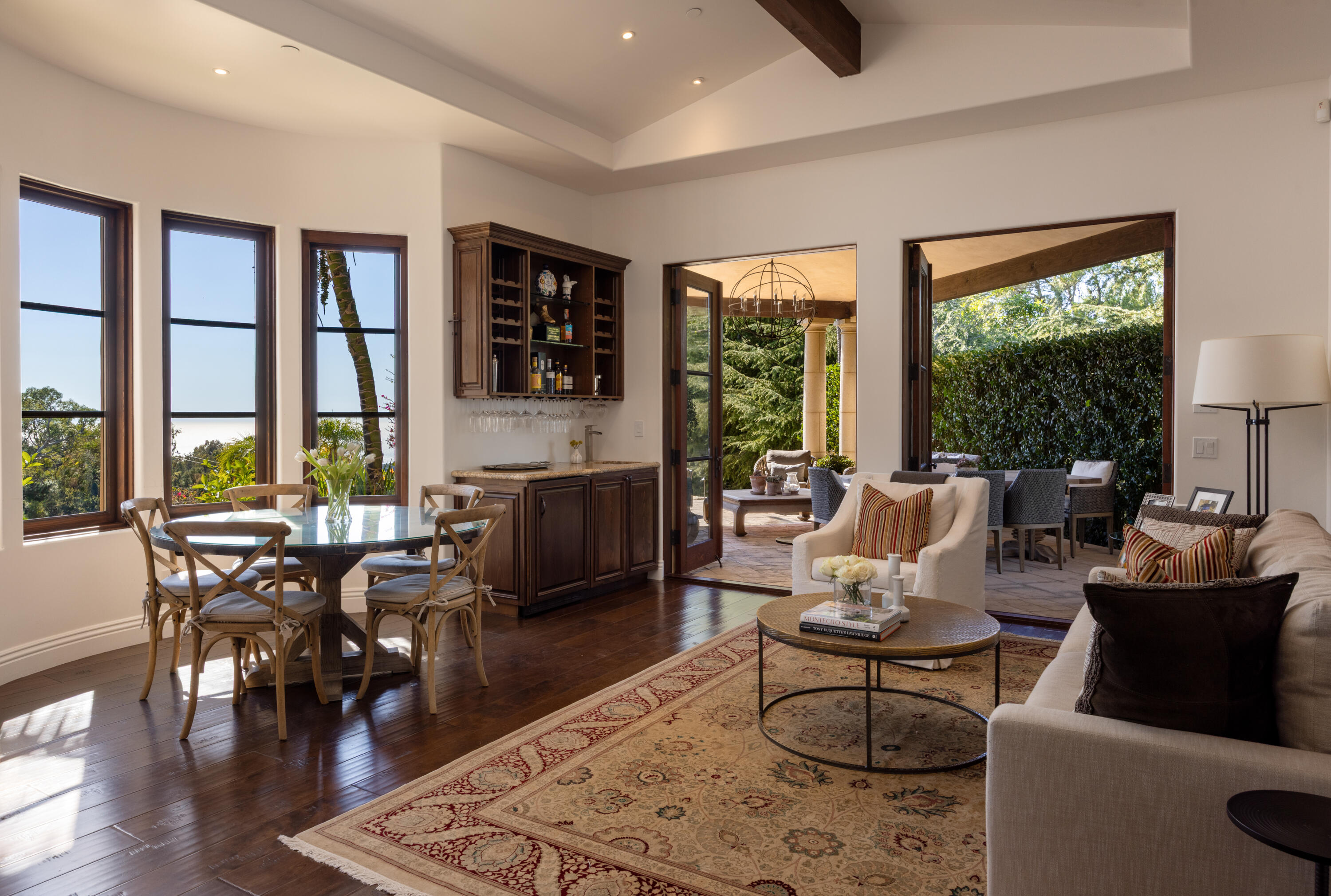 3091 Hidden Valley Lane Montecito, CA 93108 - Photo 20 of 62 a living room with furniture and a floor to ceiling window