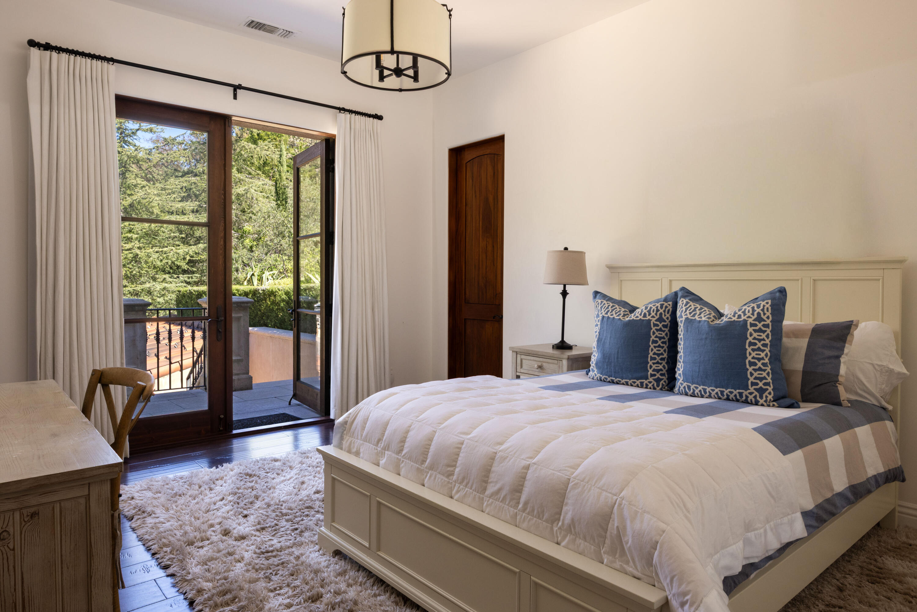 3091 Hidden Valley Lane Montecito, CA 93108 - Photo 25 of 62 a large bed sitting in a bedroom next to a window