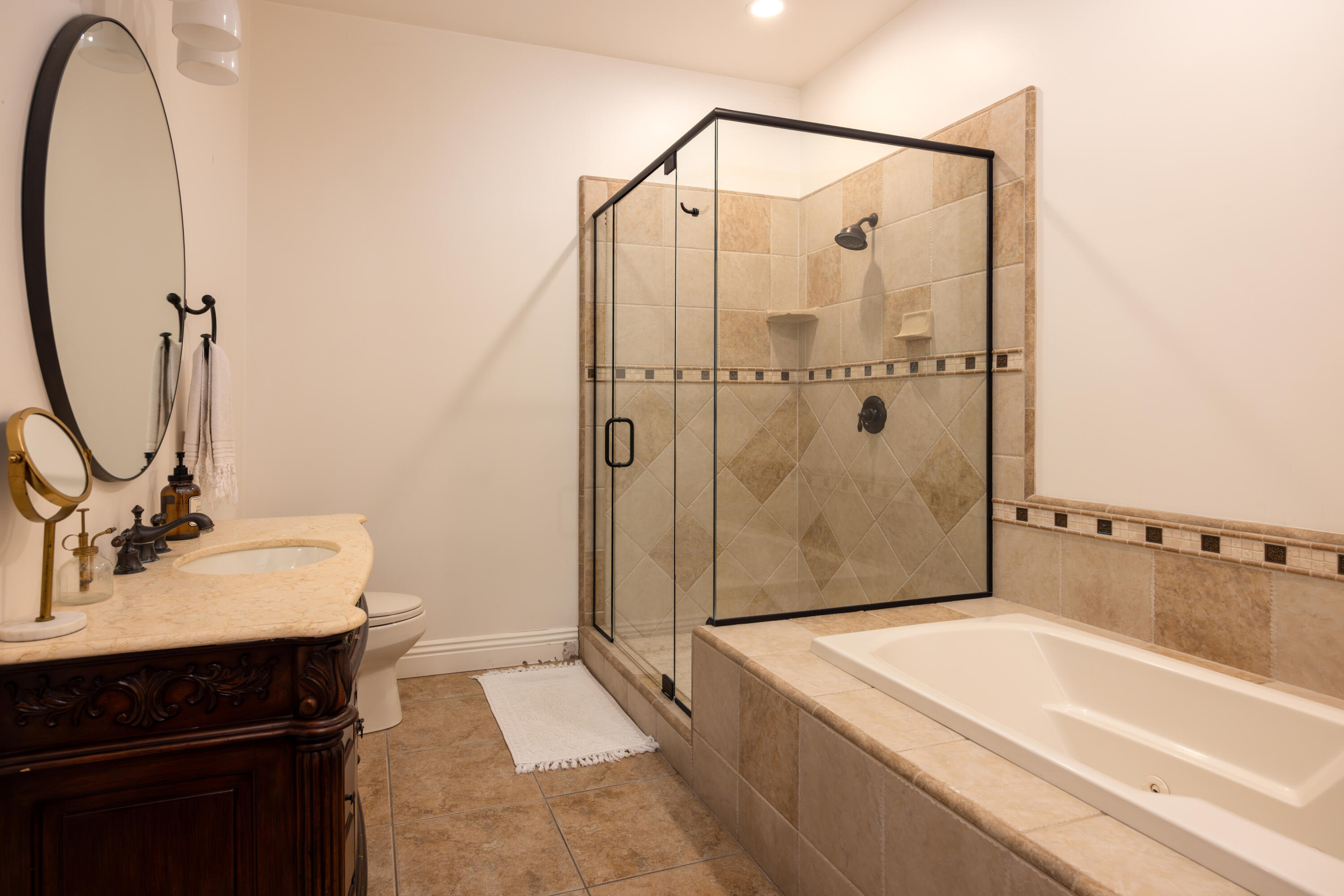 3091 Hidden Valley Lane Montecito, CA 93108 - Photo 32 of 62 a bathroom with a sink and a mirror