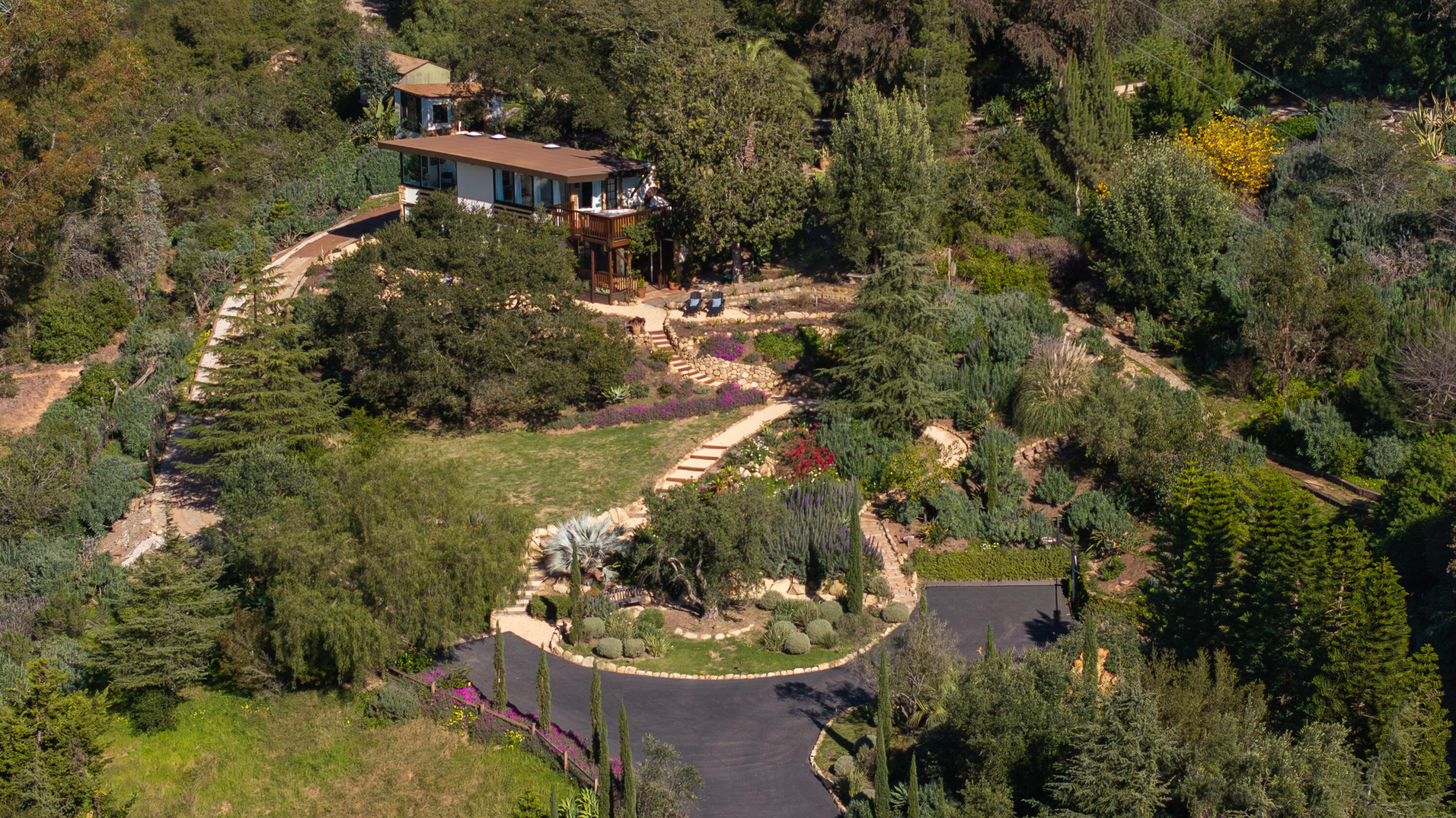 3091 Hidden Valley Lane Montecito, CA 93108 - Photo 38 of 62 a aerial view of a house with a yard and lake view