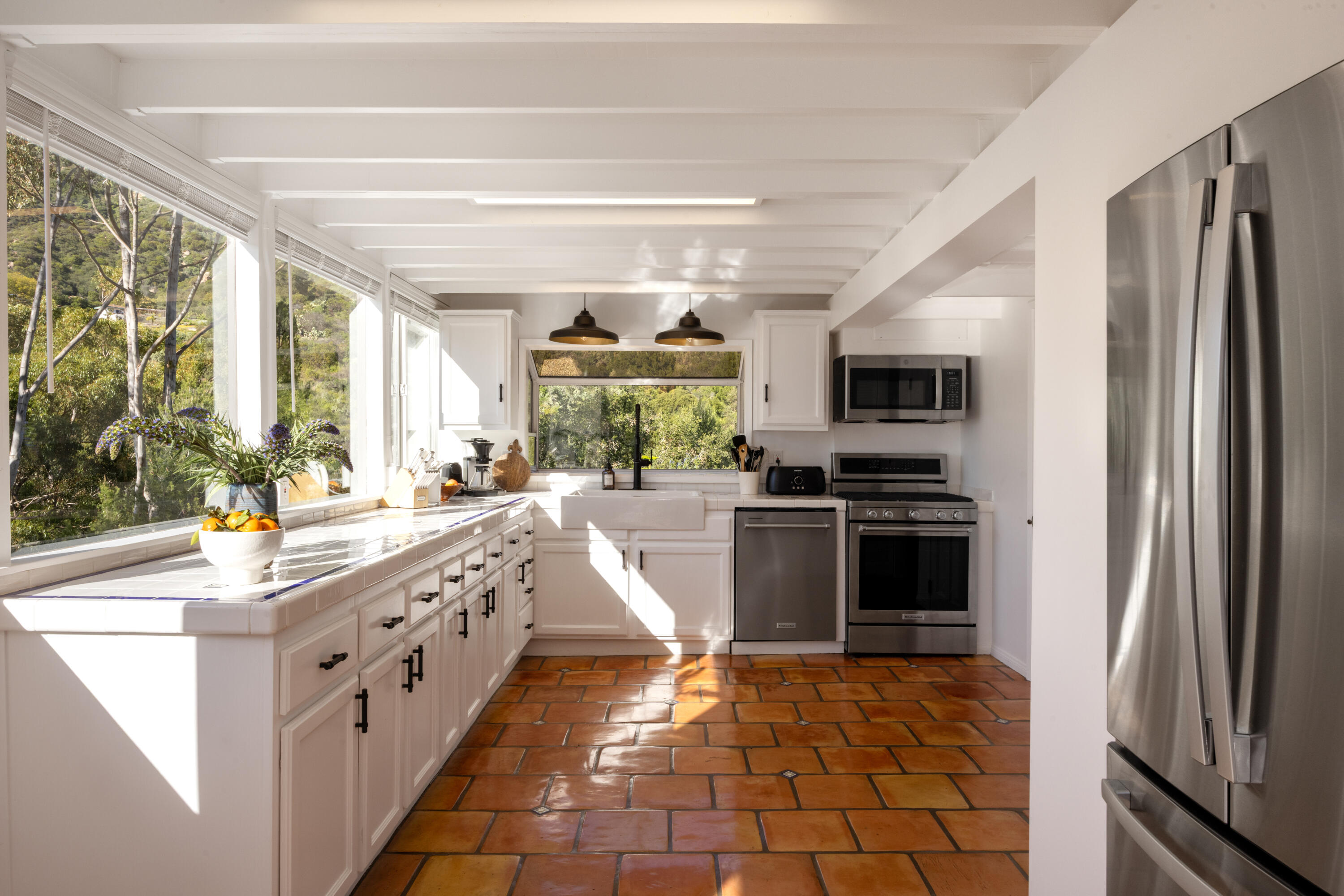 3091 Hidden Valley Lane Montecito, CA 93108 - Photo 41 of 62 a kitchen with stainless steel appliances granite countertop a stove a sink and a refrigerator