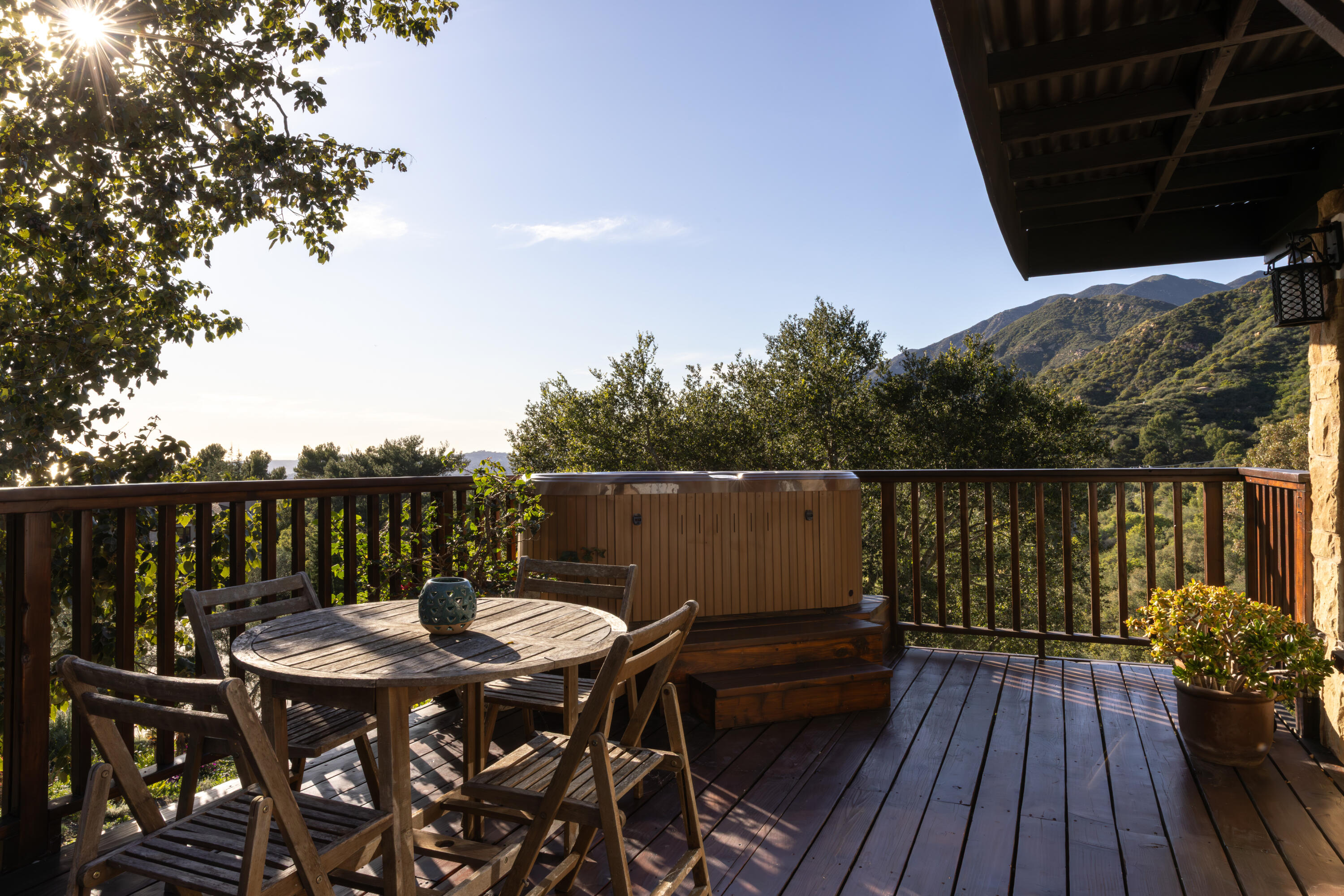 3091 Hidden Valley Lane Montecito, CA 93108 - Photo 46 of 62 a view of a balcony with wooden floor and outdoor seating
