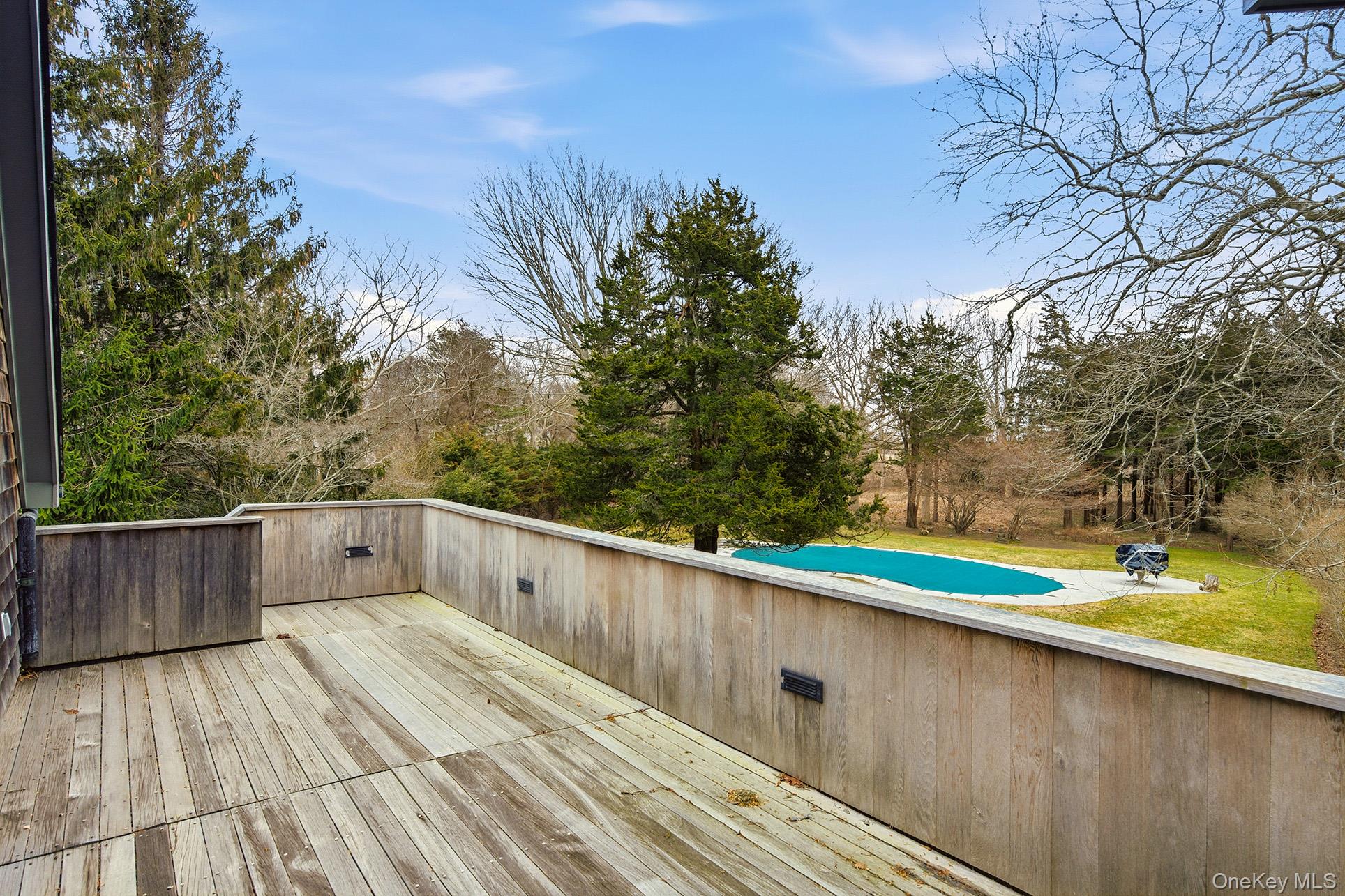 60 Skimhampton Road East Hampton, NY 11937 - Photo 29 of 37 a view of a wooden deck with a backyard