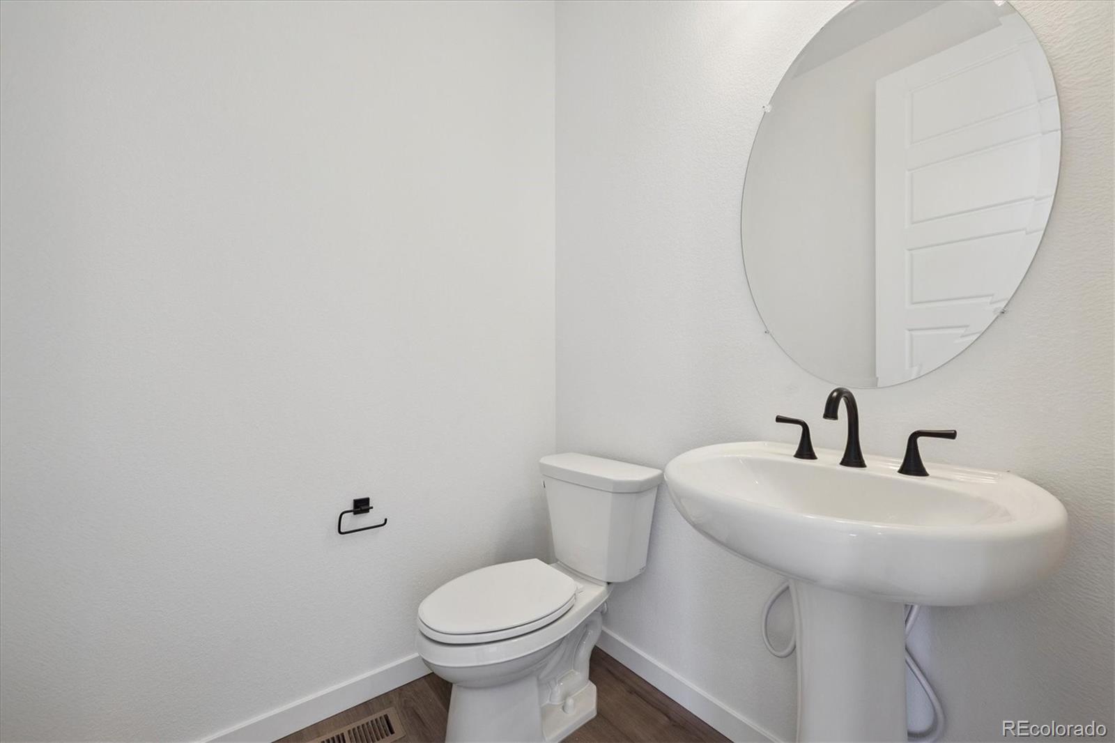 1227 Rhett Drive Erie, CO 80026 - Photo 13 of 24 a bathroom with a sink and a toilet