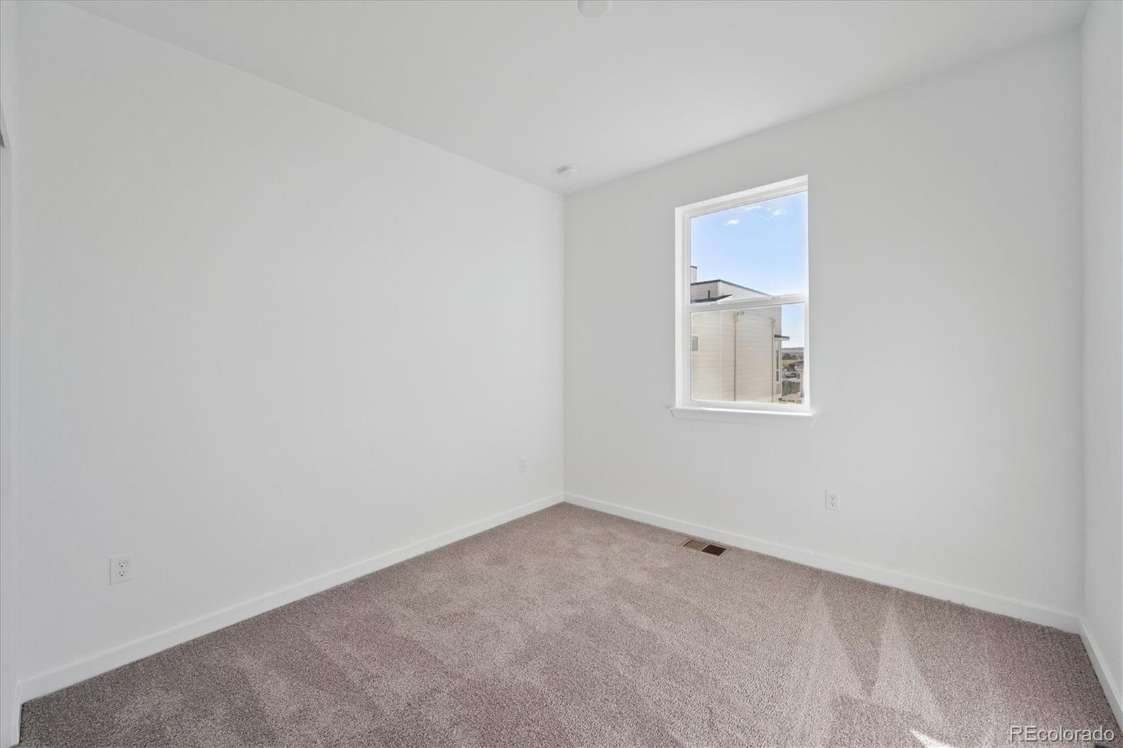 1227 Rhett Drive Erie, CO 80026 - Photo 16 of 24 an empty room with windows