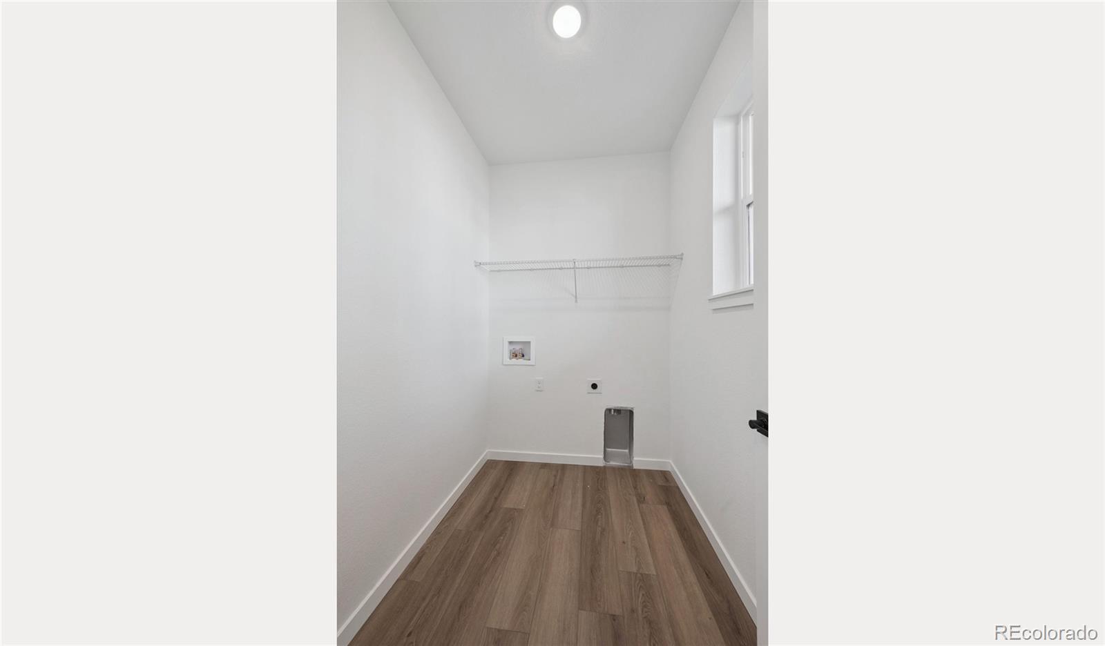 1227 Rhett Drive Erie, CO 80026 - Photo 3 of 24 a view of a room with wooden floor