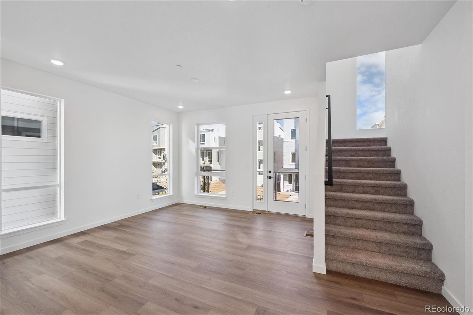 1227 Rhett Drive Erie, CO 80026 - Photo 4 of 24 a view of an entryway with wooden floor