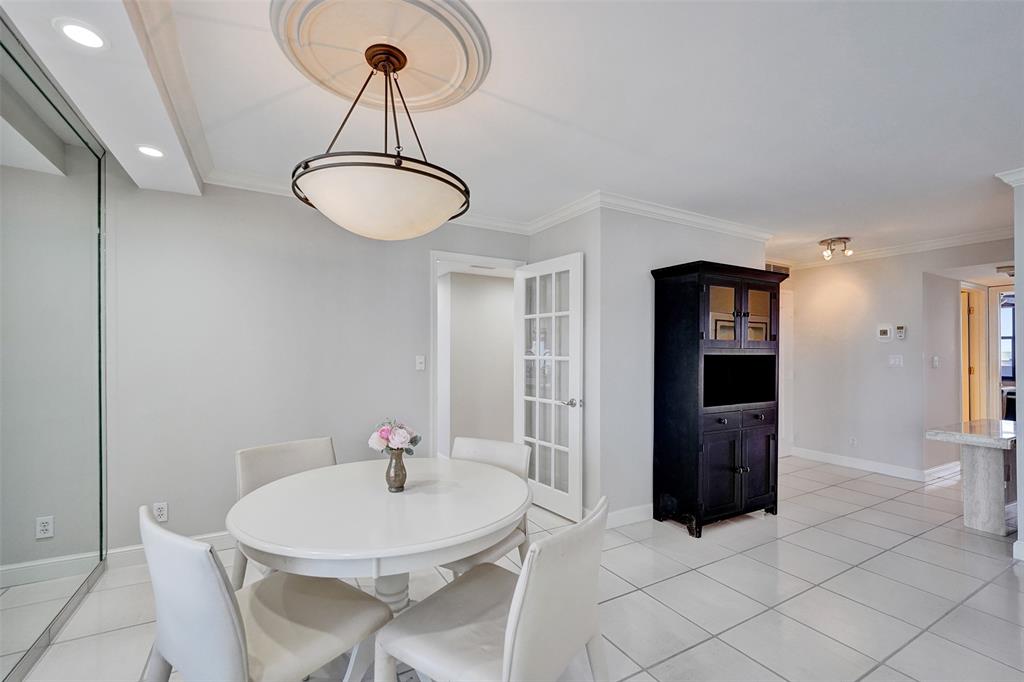 936 Intracoastal Drive, Unit 12C Fort Lauderdale, FL 33304 - Photo 14 of 65 a dining room with furniture and window