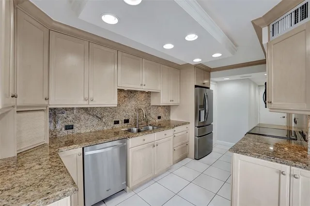 a balcony with furniture and a potted plant