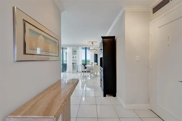 a living room with furniture and a ceiling fan