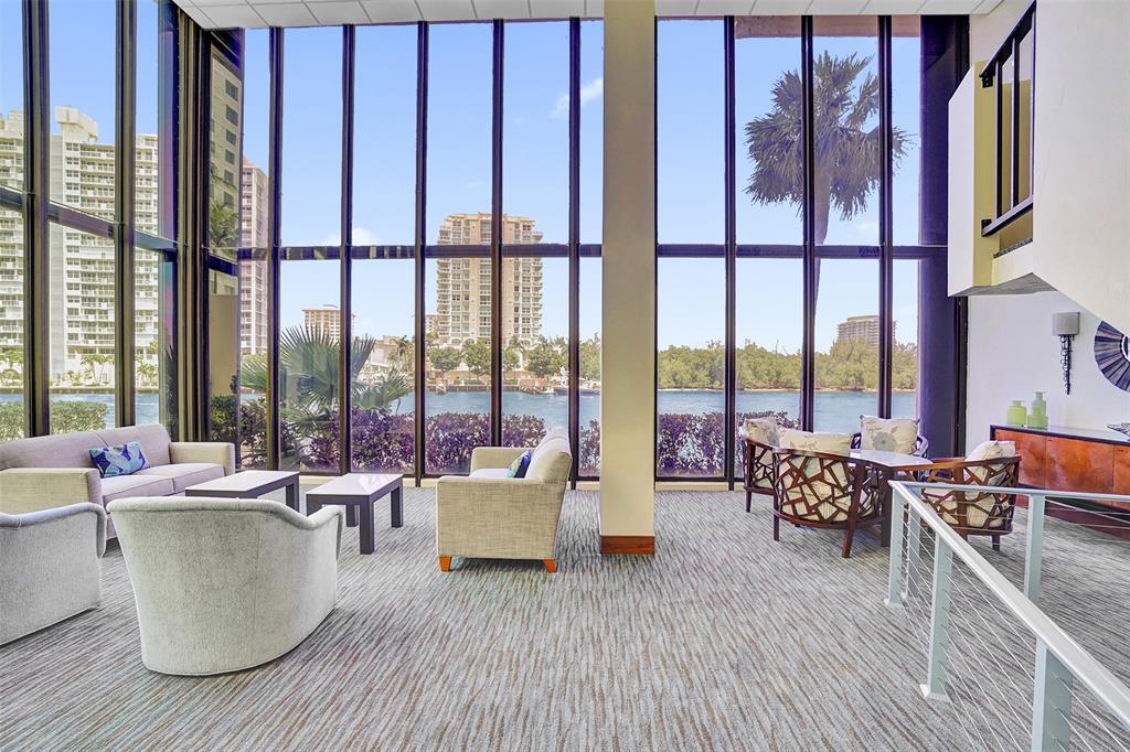 936 Intracoastal Drive, Unit 12C Fort Lauderdale, FL 33304 - Photo 65 of 65 a living room with furniture and floor to ceiling windows