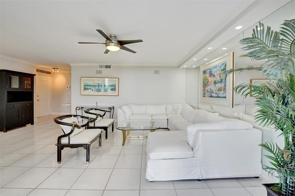 936 Intracoastal Drive, Unit 12C Fort Lauderdale, FL 33304 - Photo 10 of 65 a living room with furniture and kitchen view